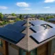 SunLith Energy Pros and cons of solar energy — rooftop solar panel installation on a home