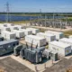 Large-scale-lithium-ion-battery-energy-storage-system-1 - SunLith Energy SunLith Energy large utility scale battery energy storage system with containerized battery units PCS equipment transformers and electrical grid infrastructure renewable energy facility