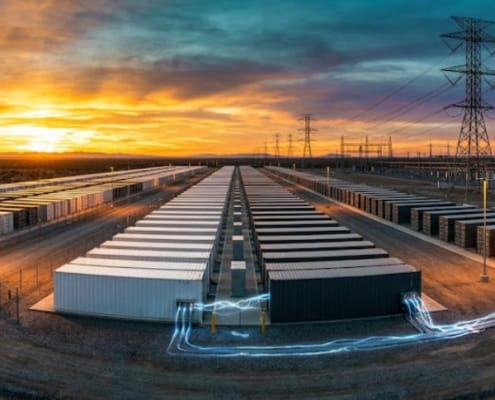 SunLith Energy BESS grid-forming technology — large utility-scale battery storage facility with power lines at dusk, Sunlith Energy