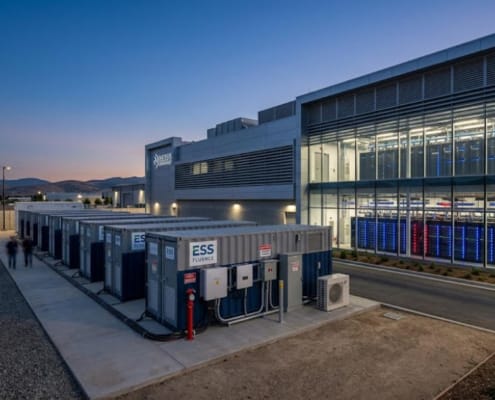 SunLith Energy AI data center BESS battery containers beside server halls