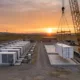 SunLith Energy BESS augmentation guide showing a battery storage site adding new racks mid-life
