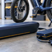 E-Bike Battery Fires Prevention Guide - SunLith Energy SunLith Energy E-bike battery fires prevention: certified e-bike battery pack and charger on a hard surface